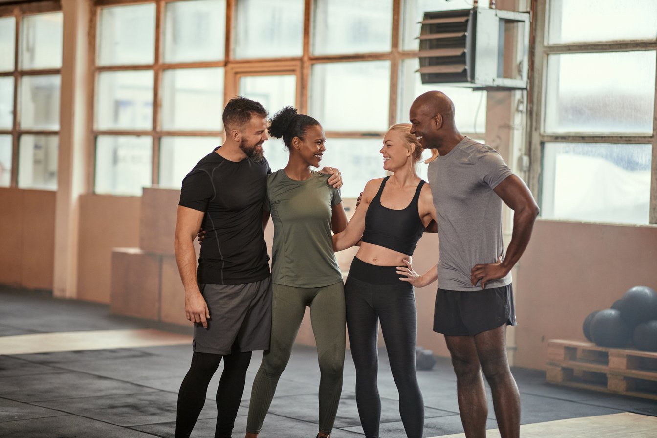 Diverse Group of Happy Friends Standing in Gym