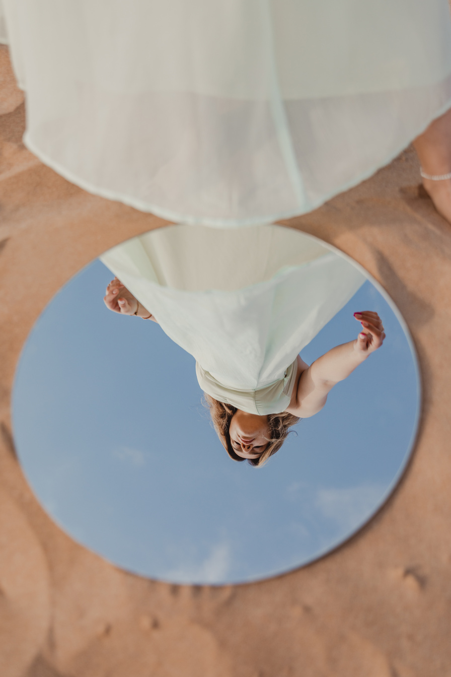 Woman in White Dress Reflected on Mirror